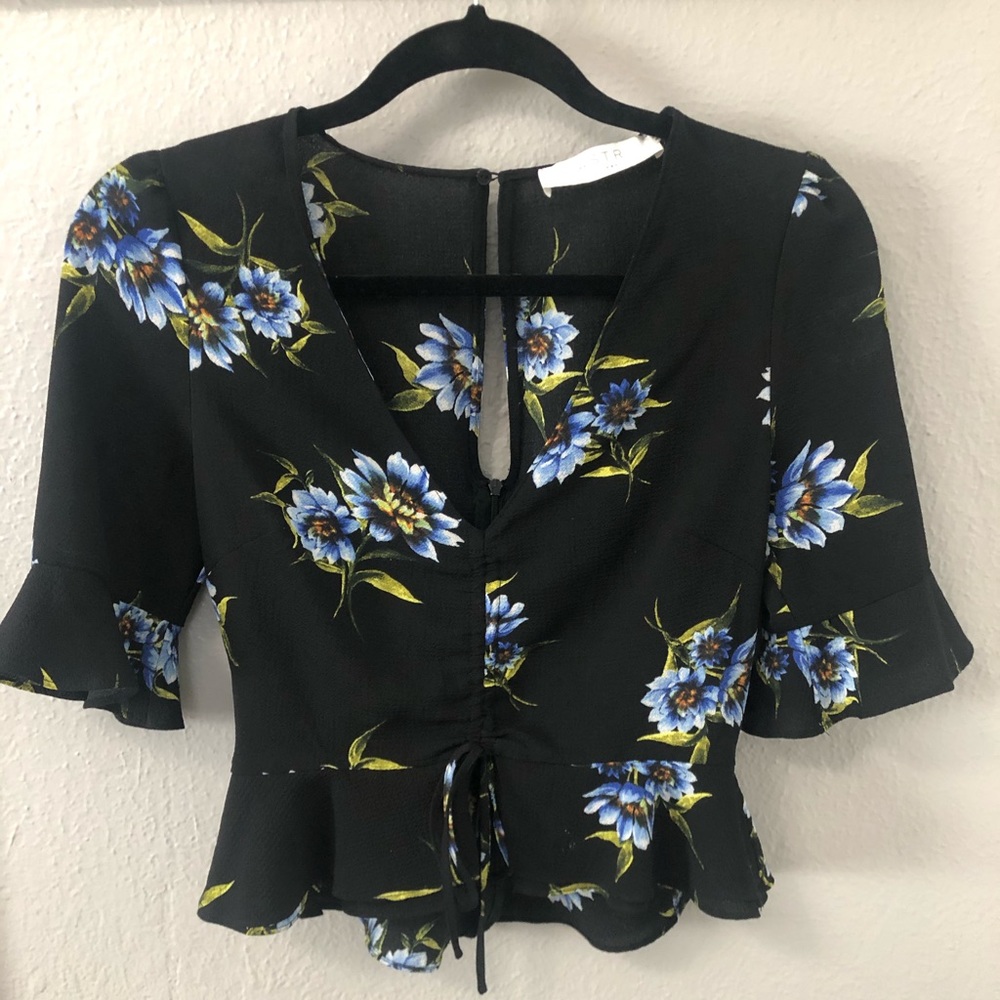 Black top with flowers on it